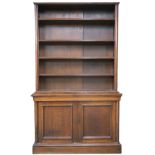 A Victorian stained oak open library bookcase with four open shelves on base with pair of panelled
