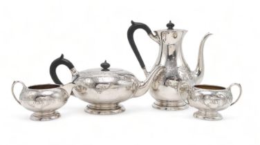 A CANADIAN FOUR PIECE SILVER TEA SERVICE by Birks, 1933, of baluster form, with engraved scrolling