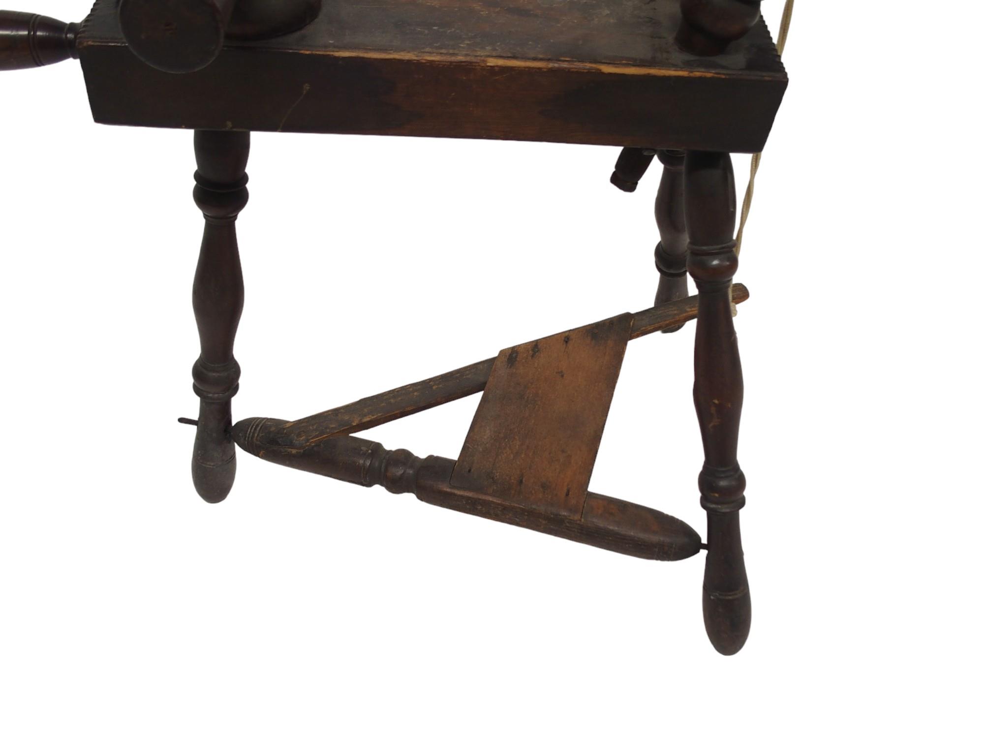 A 19TH CENTURY SCOTTISH SPINING WHEEL  with 56cm turned spindle wheel on turned supports joined by - Image 5 of 6