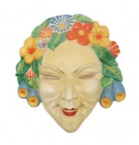 A CLARICE CLIFF FLORA WALL MASK circa 1936, relief moulded as a lady's face with floral hairband