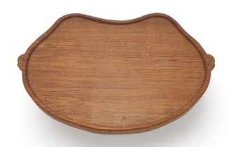 ROBERT MOUSEMAN THOMPSON (1876-1955) An oak kidney shaped tea tray, with twin carved mouse signature