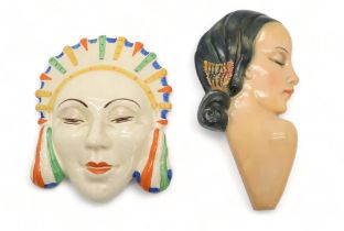 AN UNMARKED POTTERY WALL MASK in the style of Clarice Cliff, 16.5cm high, together with a Wade