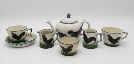 A COLLECTION OF WEMYSS WARE BLACK COCKEREL AND HEN PATTERN TEA WARES including a Bon Jour cup and