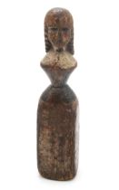 A FOLK ART CARVED AND PAINTED PINE FEMALE FIGURE Possibly a newel post finial, formed as a woman