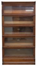 A 20TH CENTURY STAINED OAK GLOBE WERNICKE CO LTD SECTIONAL BOOKCASE  with shaped top over five