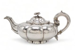 A WILLIAM IV SILVER TEAPOT by Charles Gordon, London 1833, of compressed melon form, with a floral