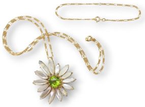 A MOONSTONE AND PERIDOT FLOWER mounted in 18ct gold to be worn as a pendant or brooch, stamped