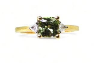 AN APATITE AND DIAMOND RING set with a cushion cut pale green apatite, approx 6mm x 6mm, with two