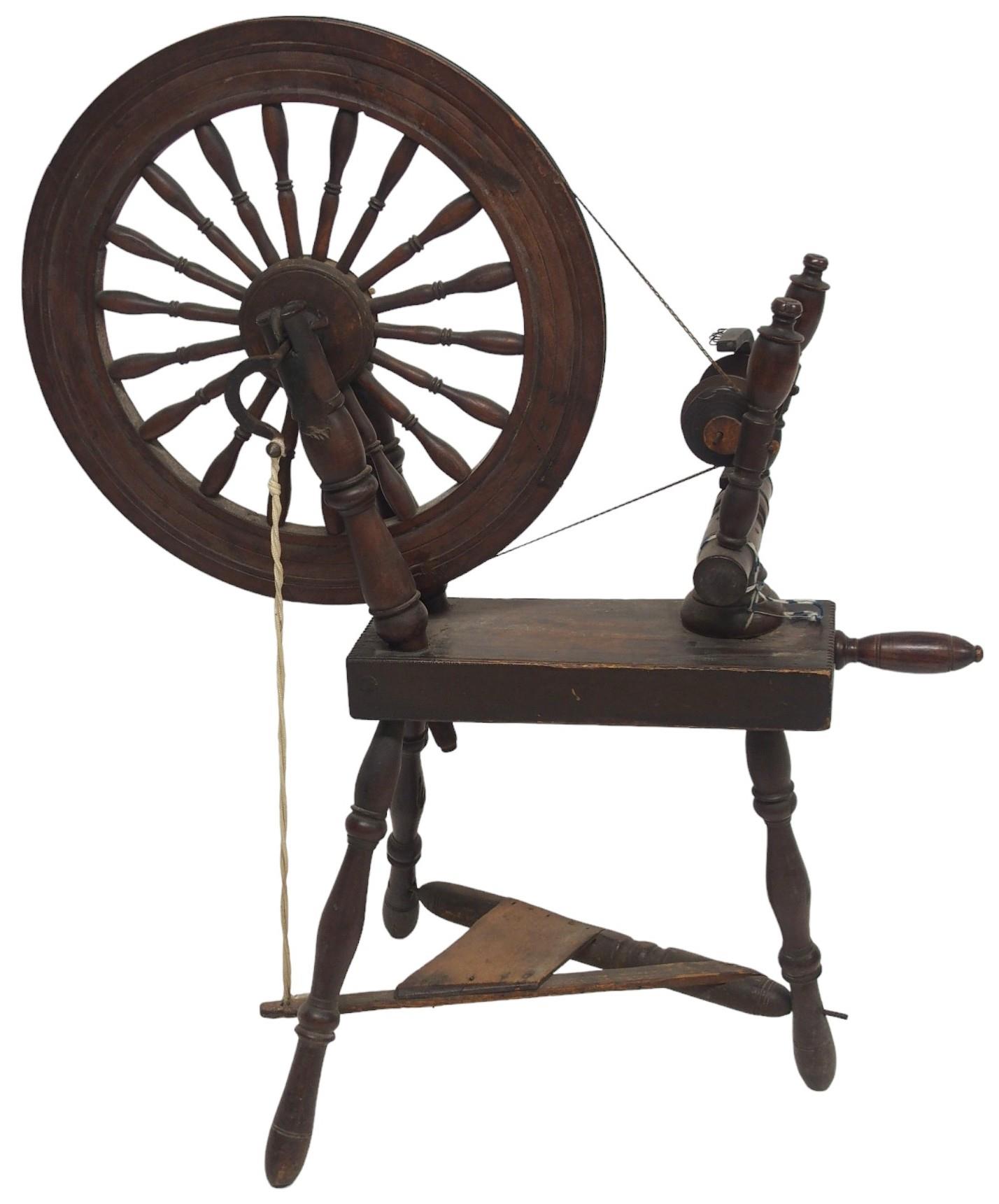 A 19TH CENTURY SCOTTISH SPINING WHEEL  with 56cm turned spindle wheel on turned supports joined by