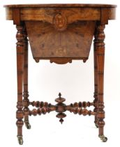 A VICTORIAN WALNUT & SATINWOOD INLAID SEWING TABLE  with oval hinged top concealing fitted