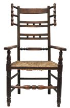 A 19TH CENTURY ASH LANCASHIRE CHAIR with spindle back and wings over shaped arms flanking rushed