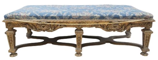 AN 18TH CENTURY STYLE GILTWOOD FRAMED BENCH/WINDOW SEAT with floral upholstered seat over