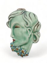 A CLARICE CLIFF WALL MASK circa 1936, moulded as a lady in profile with blue and orange flowers