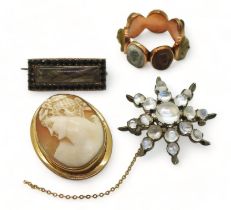 FOUR ANTIQUE JEWELS to include a rose coloured metal lava cameo ring, each of the seven panels