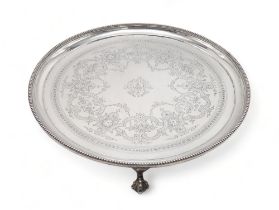 A VICTORIAN SILVER SALVER by Elkington & Co, London 1878, of circular form, with engraved