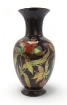 A ZSOLNAY PECS VASE of shouldered form with flaring neck, decorated with flowers and foliage with