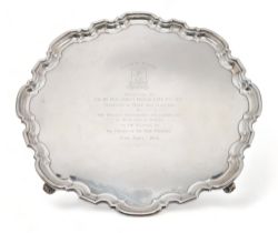 A GEORGE VI SILVER SALVER by Atkins Brothers, Sheffield 1947, of shaped circular form, with a