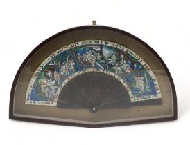 A CANTONESE EXPORT FAN Tortoiseshell, ivory and paper, painted with a mandarin and courtiers on