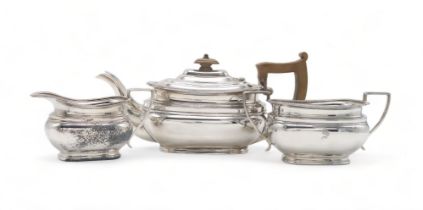 A GEORGE VI THREE PIECE SILVER TEA SERVICE by Edward & Sons, Sheffield 1937, of shaped rectangular