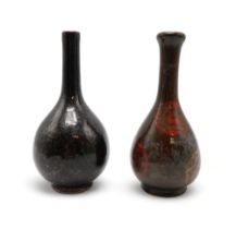 A MONOCHROME BOTTLE SHAPED VASE Painted with flaming pearl medallions, 18.5cm high, possibly Korean,