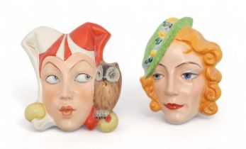 A CZECHOSLOVAKIAN ART DECO WALL MASK modelled as a jester with an owl perched on her shoulder,