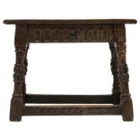 A 17TH CENTURY STYLE OAK JOINT STOOL  with rectangular top over carved friezes on turned supports