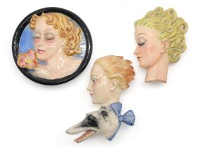 A GOEBEL WALL MASK BY AGNES RICHARDSON modelled as a girls head with curly blonde hair, no R24, 21.