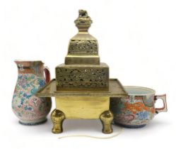 A LARGE CHINESE BRASS TEMPLE CENSER  With dragon finial above pierced dragon friezes, 47cm high