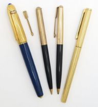 A PASHA DE CARTIER FOUNTAIN PEN The fluted cap inset with a blue cabochon and stamped "1989 0071",