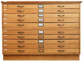 A 20TH CENTURY PITCH PINE PLAN CHEST with laminate top over ten narrow folio drawers on plinth base,