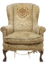 AN EARLY 20TH CENTURY GEORGIAN STYLE WINGBACK ARMCHAIR  with Damask upholstery on carved lions paw