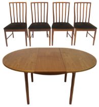 A MID 20TH CENTURY TEAK MCINTOSH CIRCULAR EXTENDING DINING TABLE AND FOUR CHAIRS  dining table