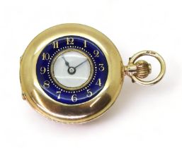 A LADIES HALF HUNTER FOB WATCH in 12ct gold with blue and gold enamelled chapter ring to the outer