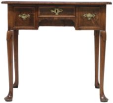 A 19TH CENTURY MAHOGANY LOWBOY with shaped crossbanded veneered top over shallow central drawer