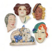 A COLLECTION OF CZECHOSLOVAKIAN ART DECO WALL MASKS all of girls' heads, some with incised and