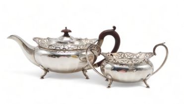 A GEORGE V SILVER PART TEA SERVICE by William Adam, Birmingham 1930, of faceted oval form, with