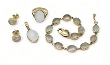 A SET OF 9CT MOONSTONE JEWELS comprising of ring, size I1/2 (I for India), stud earrings, a