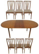 A 20TH CENTURY TEAK MEREDEW EXTENDING DINING TABLE AND SIX CHAIRS  dining table with oval top