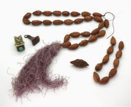 A COLLECTION including a string of Chinese hediao nut carved beads, each carved with a different