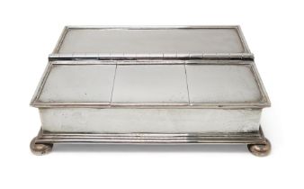 AN EDWARDIAN SILVER DESK BOX by Harrods, London 1913, of rectangular form, with a glass-lined pen