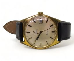 AN OMEGA AUTOMATIC GENEVE with a gold plated case, date aperture cream dial with black & gold