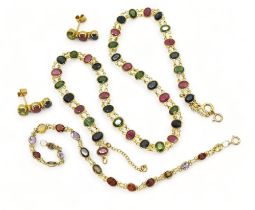 A SUITE OF MULTICOLOURED GEM JEWELS to include and 18ct gold necklace spectacle set with oval cut