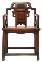 A 19TH CENTURY CHINESE HARDWOOD ARMCHAIR  with carved panelled backrest over shaped arms flanking