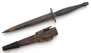 A WW2 SECOND PATTERN FAIRBAIRN-SYKES COMMANDO DAGGER Housed in a steel-tipped leather scabbard, with