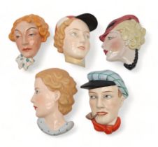 A COLLECTION OF CZECHOSLOVAKIAN AND OTHER ART DECO WALL MASKS one of a man in a cap smoking a