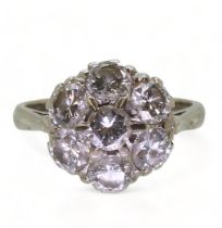 A DIAMOND FLOWER RING the classic mount in 18ct white gold is set with estimated approx 1.75cts of