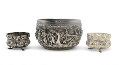 A BURMESE WHITE METAL BOWL  Decorated with a frieze of dancing figures,divided by trees and within