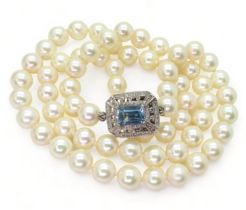 PEARLS WITH A DECORATIVE CLASP a string of good quality pearls each approx 6.3mm, overall length