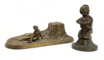 AN ART DECO BRONZE OF A GIRL modelled kneeling holding a bowl of flowers and fruit, 14.5cm high,