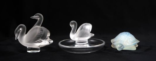 A LALIQUE SWAN RING OR PIN DISH a Lalique swan group and an opalescent model of a tortoise, all